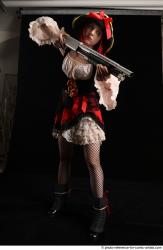 DARINA STANDING POSE WITH SHOTGUN